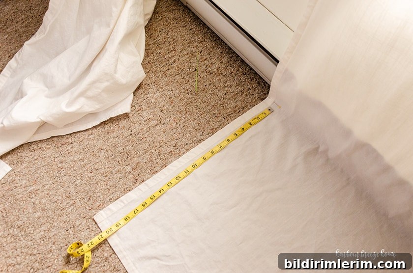 Measuring Ikea curtains before cutting them to hem them.