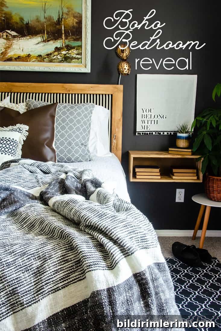 Boho Master Bedroom Makeover: Before and After Reveal 2 boho style bedroom showcaseing a bed with wooden headboard and striped upholstry, a wooden floating nightshelf, cozy throw blanket and a plant beside the nightstand.