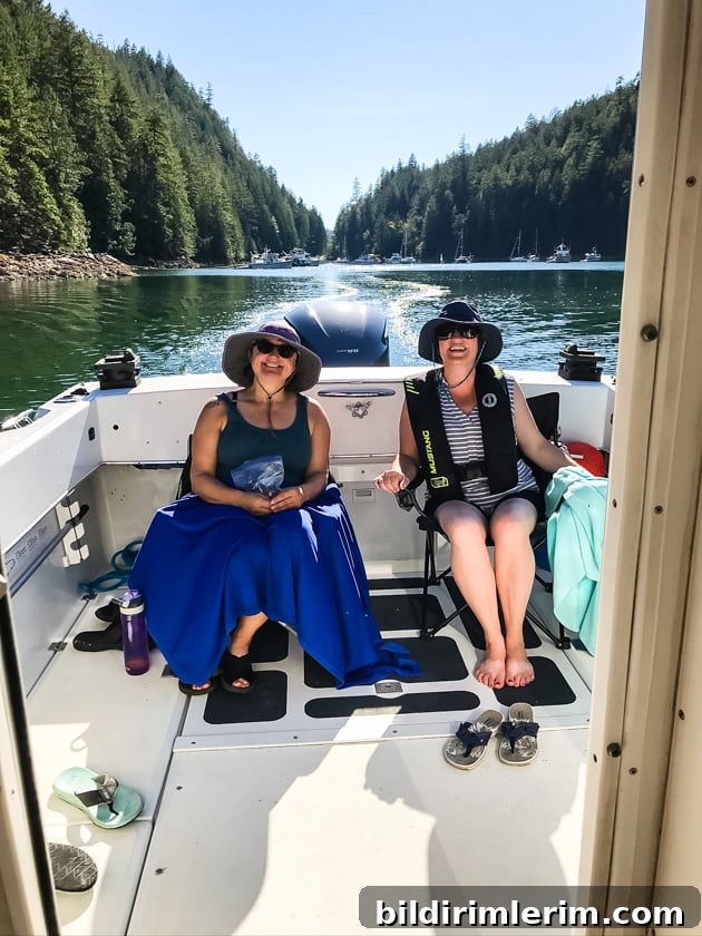 What to Pack for a Boat Trip: 10 Essential Items 4 Two women sitting in the back of a boat with bucket hats on.