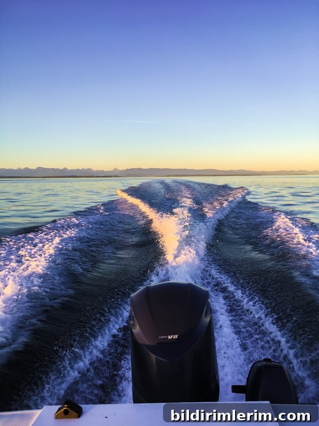 What to Pack for a Boat Trip: 10 Essential Items 6 A boat motor with a water wake behind it.