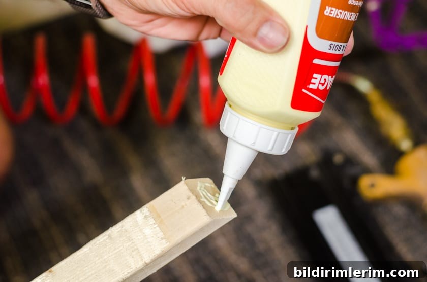 Applying wood glue to frame corners