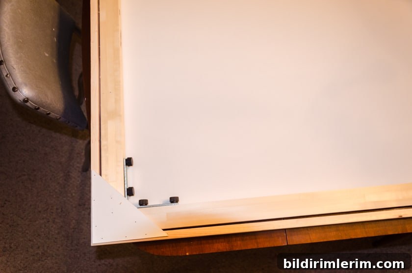 Back of canvas showing corner veneers that hold the floating frame