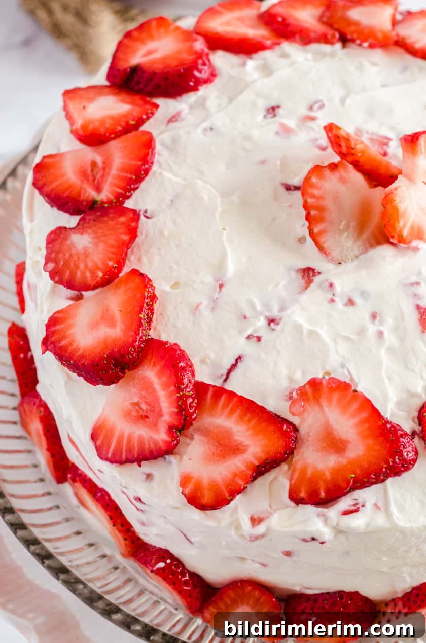 Top of Vanilla cake with Fresh strawberry icing and fresh strawberries