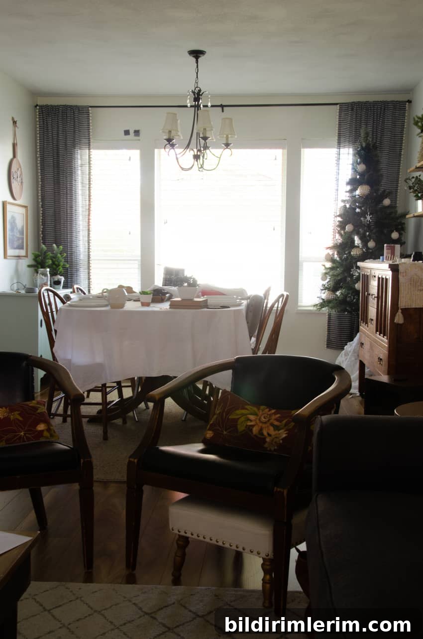 a dining room before a dark painted accent wall was added
