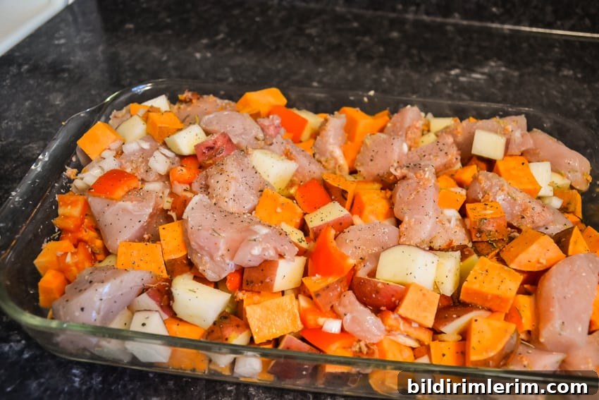 Chicken chunks placed on top of vegetables