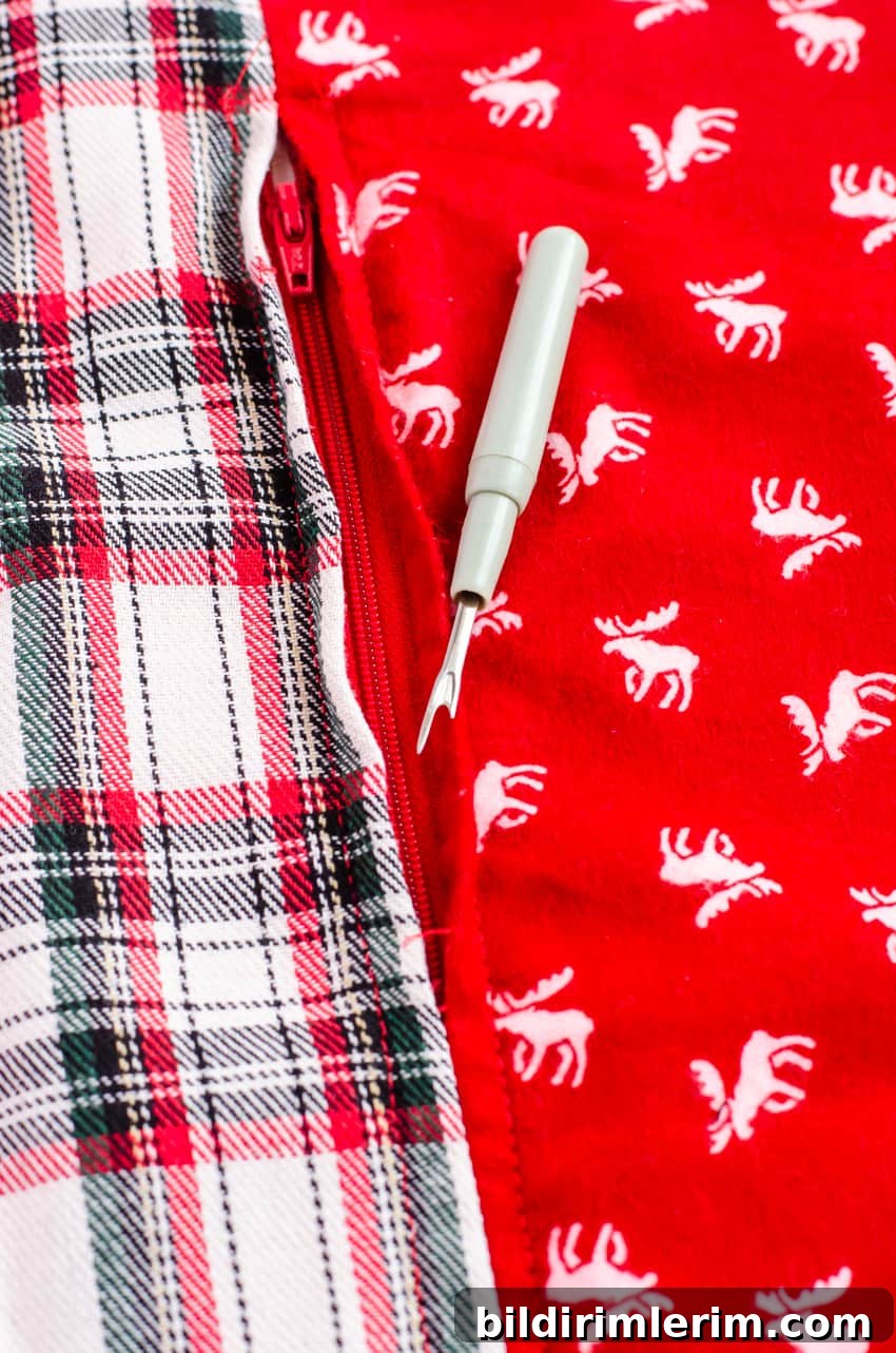 Sewing zipper to fabric