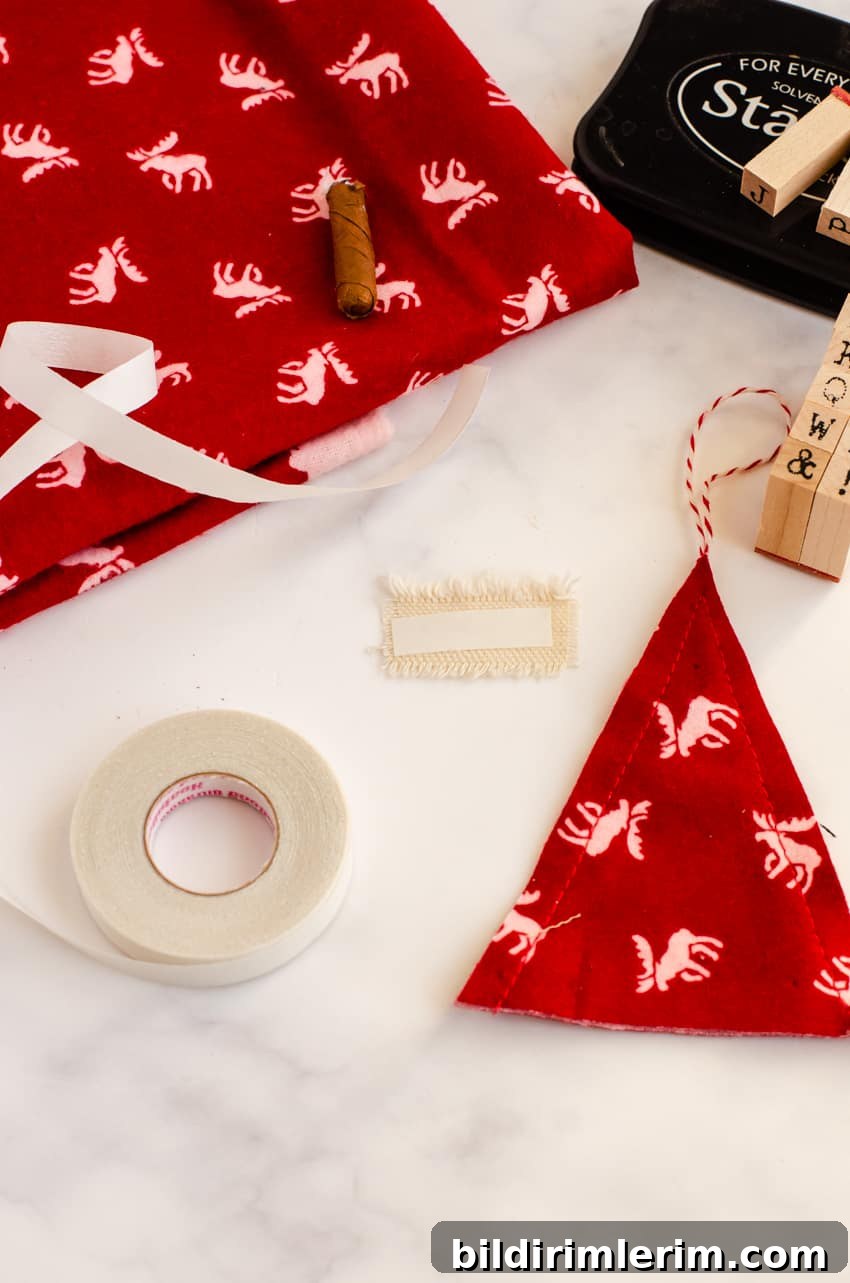 Where to iron on the heat and bond seam tape on the message tag for the DIY Christmas Tree ornament.