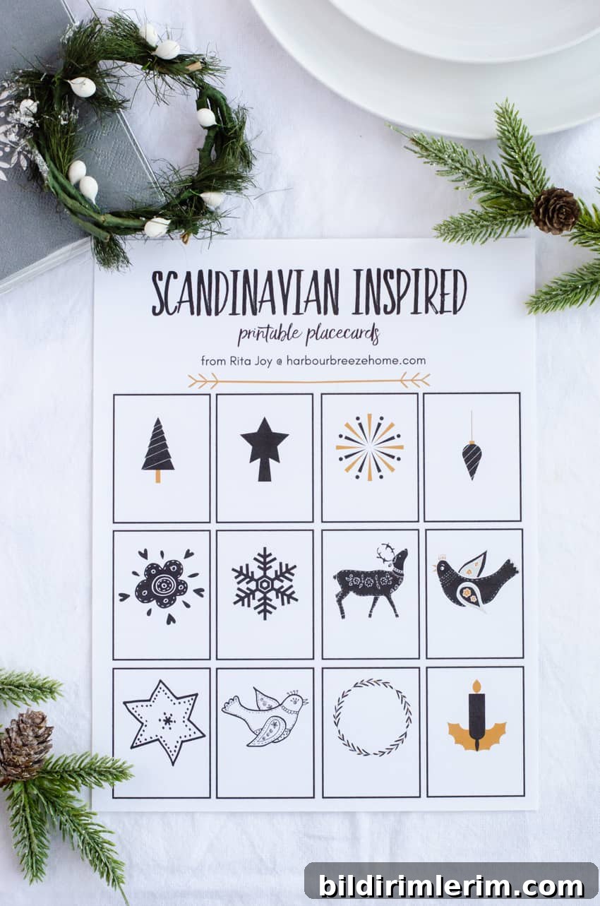 Minimal holiday table setting with greenery and place cards