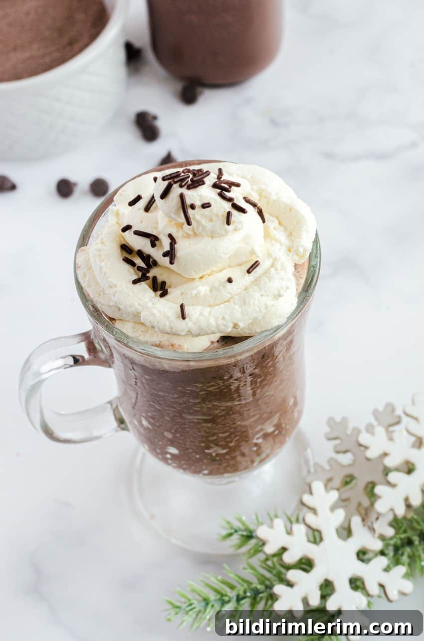 Whipping cream piled on the top of a mug of frozen hot chocolate.
