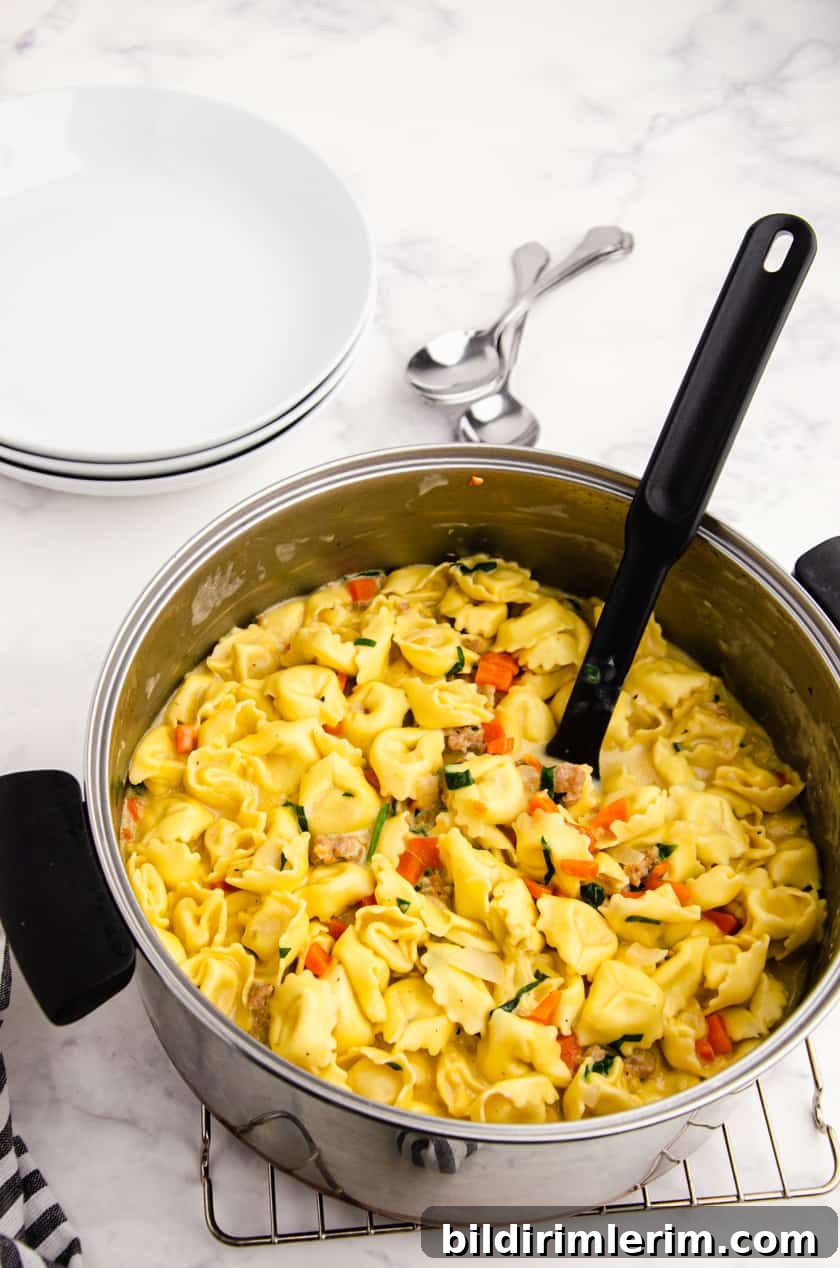 Pot of Creamy Tortellini Soup with Spinach and sausage