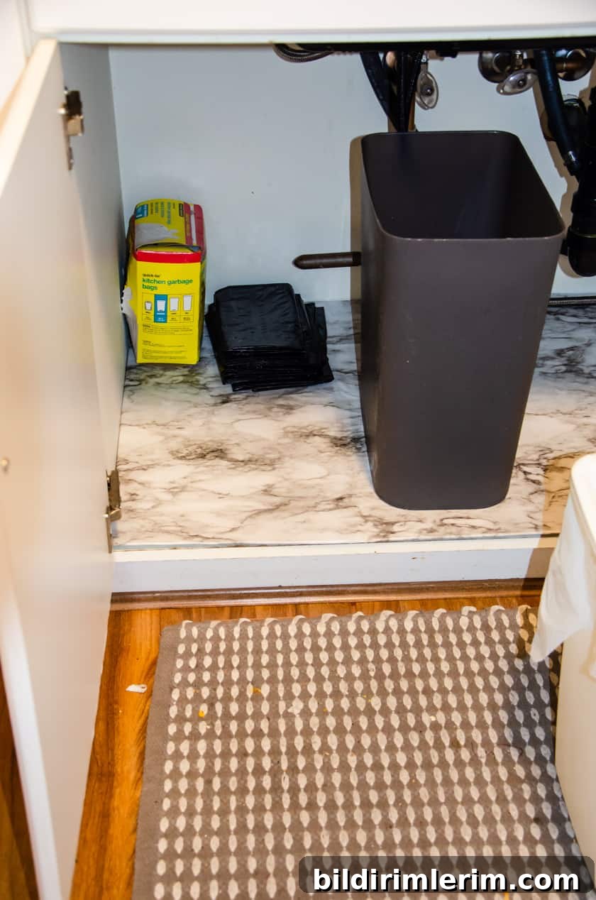 DIY under sink mat placed in cabinet under the kitchen sink
