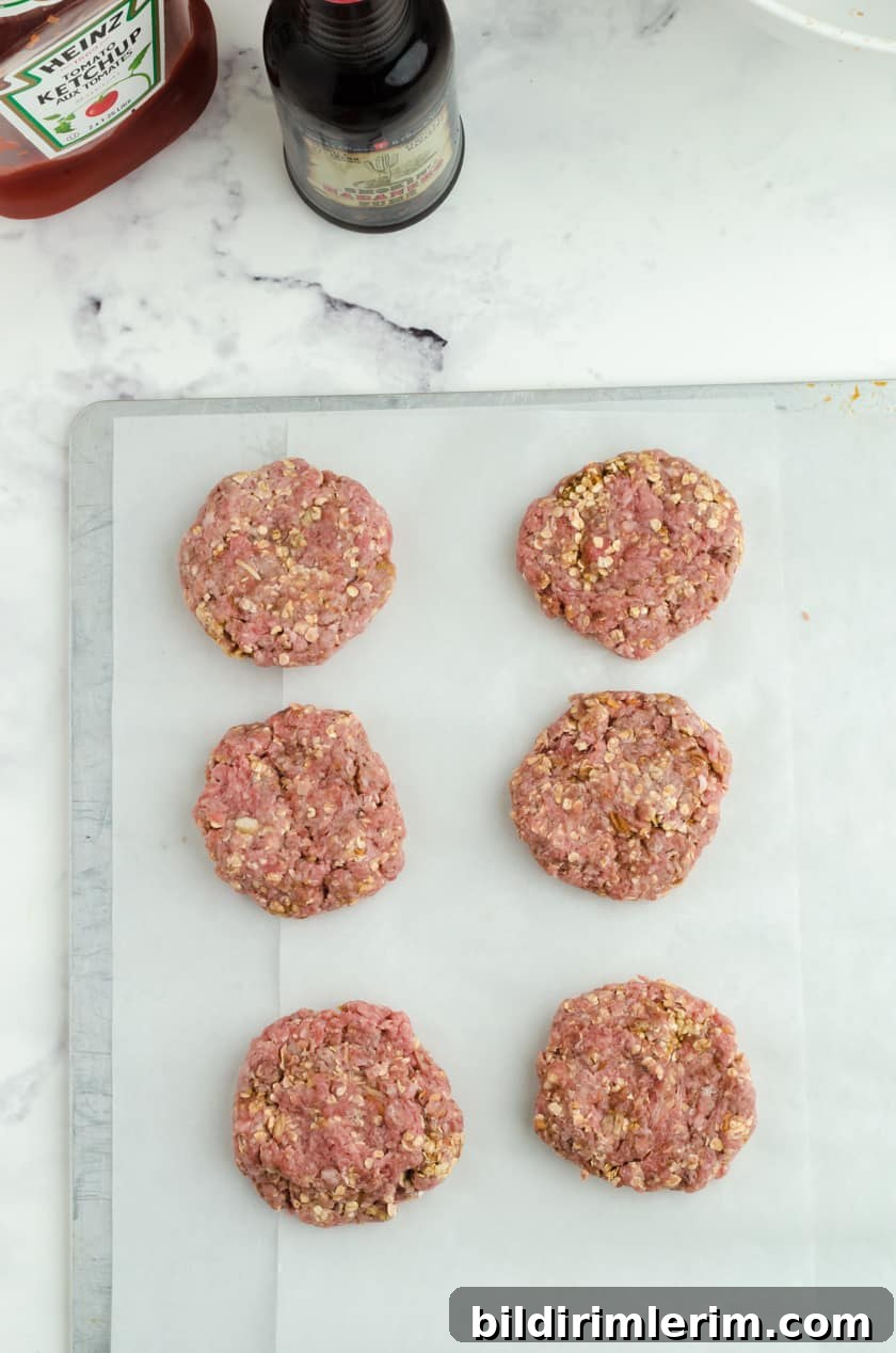 Hamburger steaks ready to put in the freezer for these make ahead baked hamburger steaks recipe.