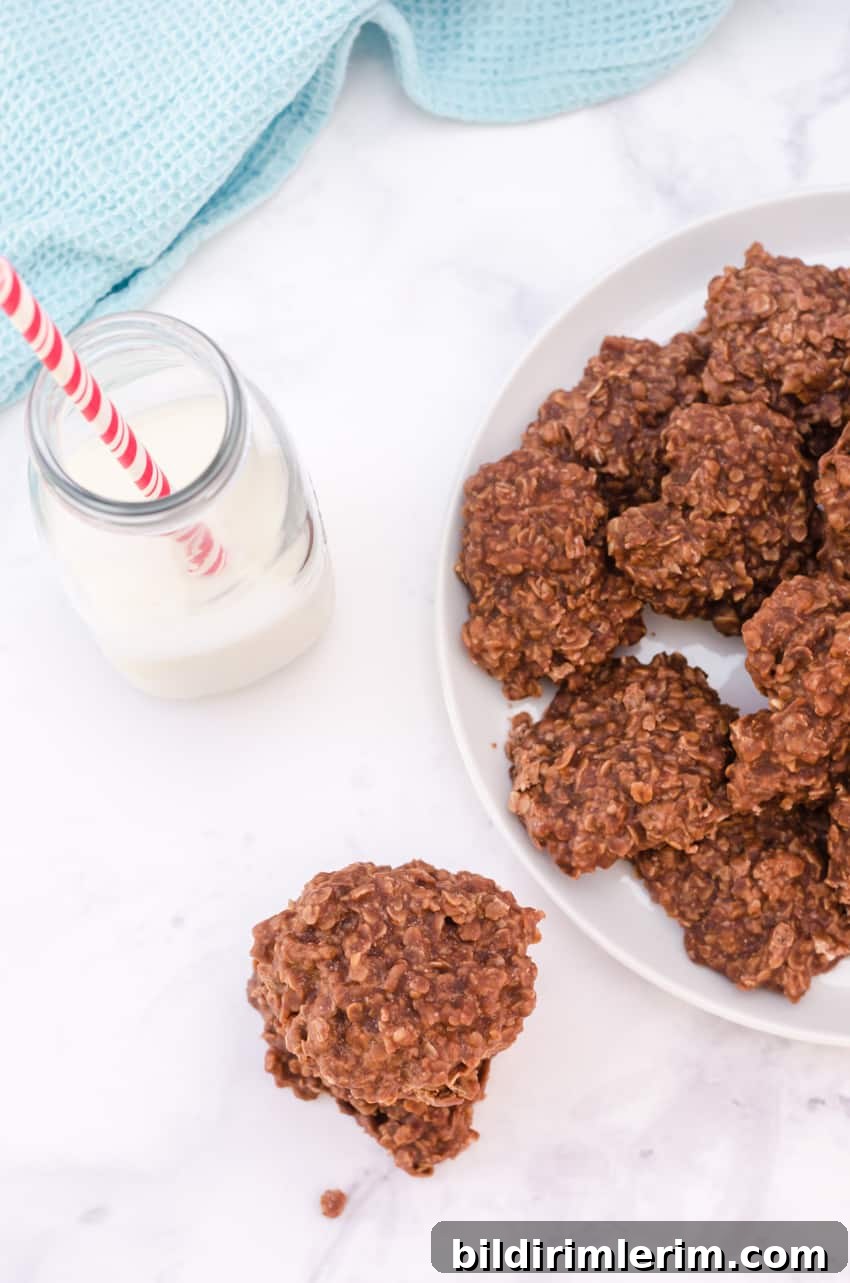 Chewy Chocolate Peanut Butter No-Bake Oatmeal Cookies 6 No bake cookies with oatmeal and chocolate on a plate with a glass of milk beside
