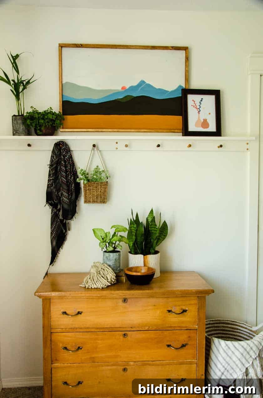 Wall shelf with wooden pegs in boho bedroom