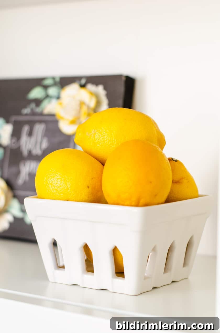 Pro Secrets to Decorating and Styling Shelves Like a Designer 7 Greenery and black accents on shelves