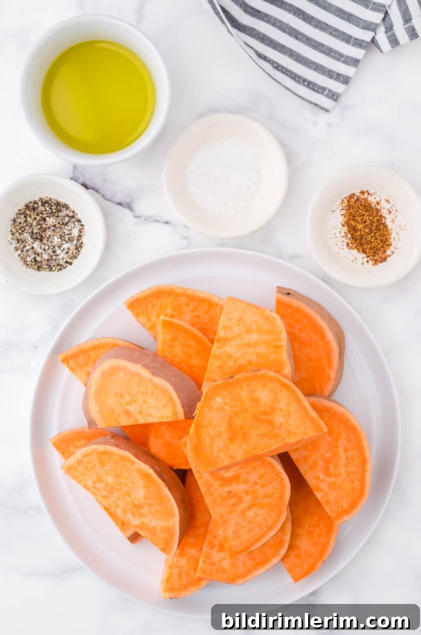 Cut giant sweet potatoe on a plate ready to be put in the microwave.