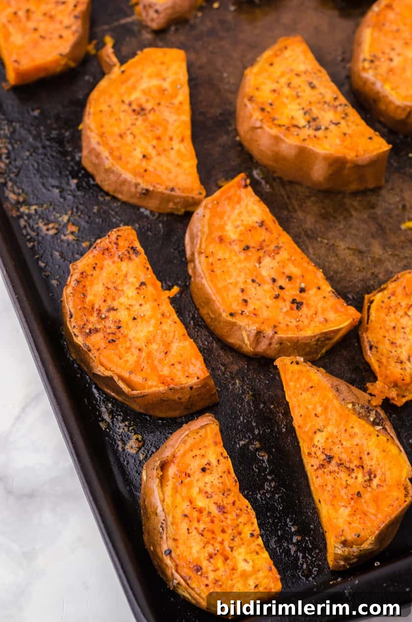 Oven baked sweet potatoes on a baking sheet
