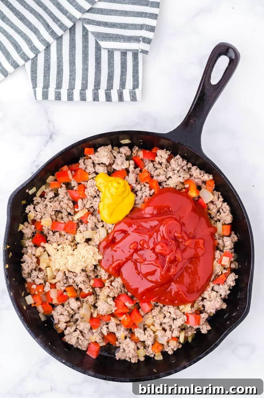 Mixing sauce into turkey