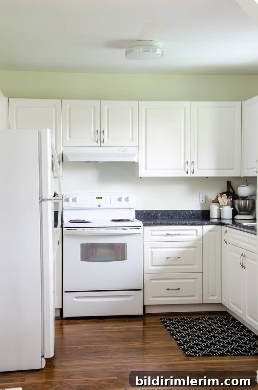 Budget-Friendly Small Kitchen Remodel Ideas 5 Small kitchen painted in Simply White paint color for a budget friendly small kitchen remodel upgrade.