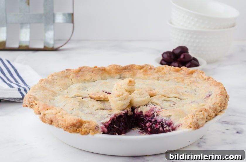 a cherry pie with a slice cut out of it
