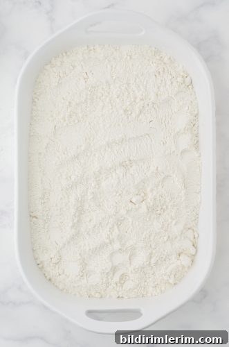 cake mix sprinkled onto cherry pie filling for cherry dump cake recipe