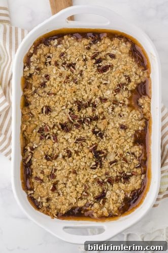 Baked apple crisp with apple pie filling in a 9x13 inch pan.