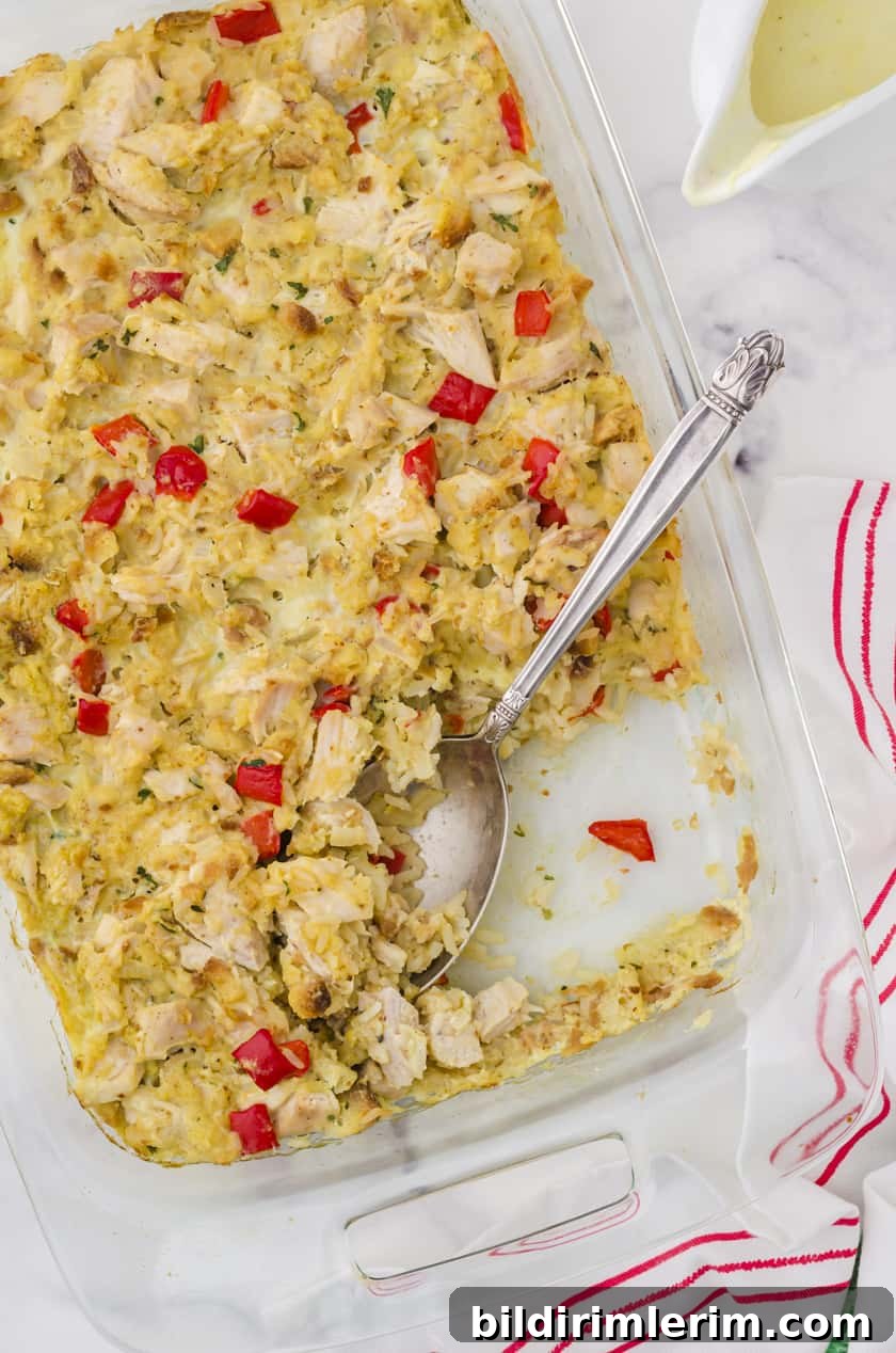 Pan of chicken stuffing casserole with a serving spoon.