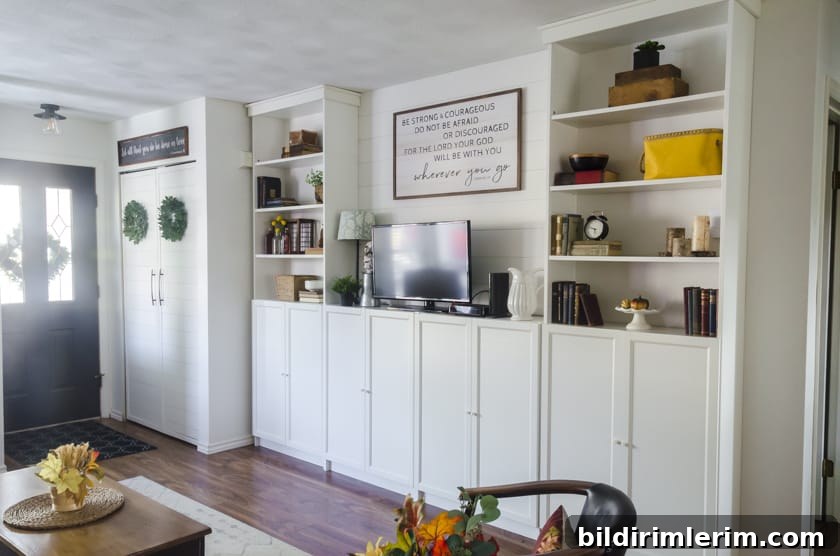 Ikea's Billy Bookcases decorated with Fall decor with neutral decor and splashes of sunflower yellow decor.