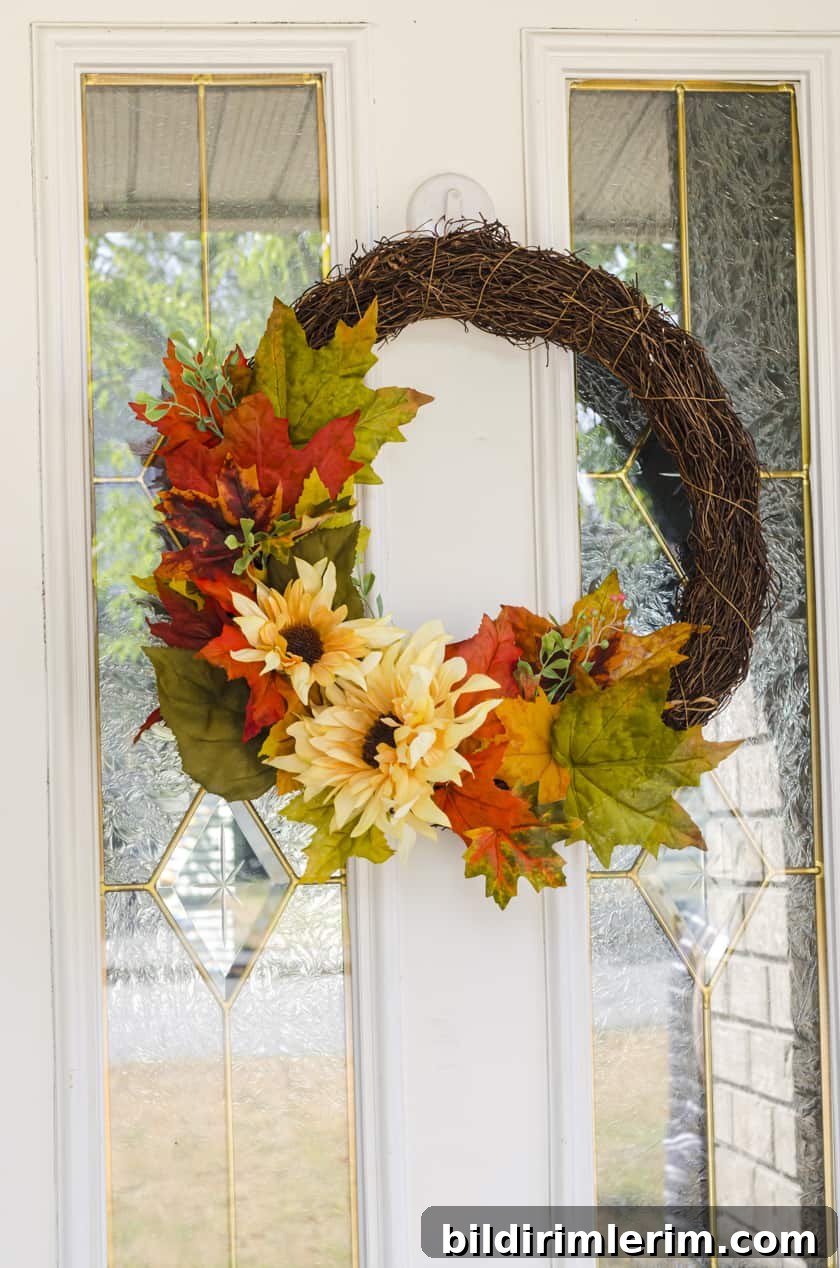 Fall wreath with fake flowers on an exterior front door