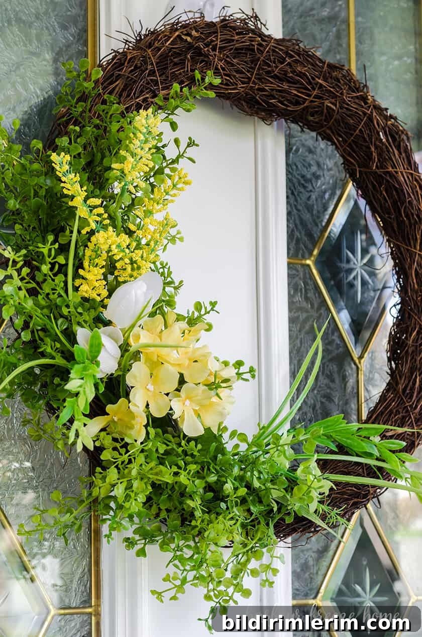 front door wreath with fake yellow flowers for Spring and Summer