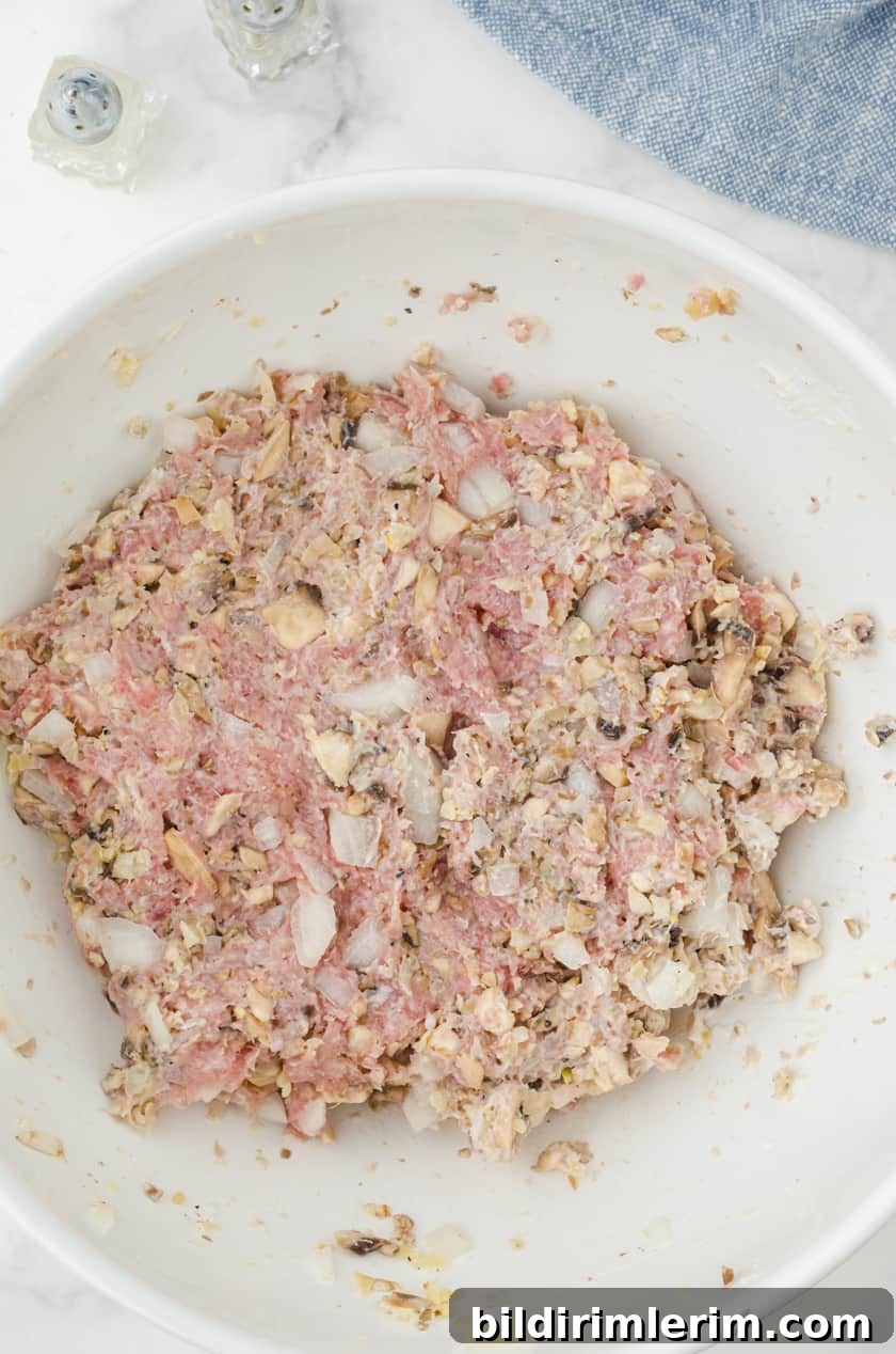Mix the ingredients for turkey burgers in a large mixing bowl.