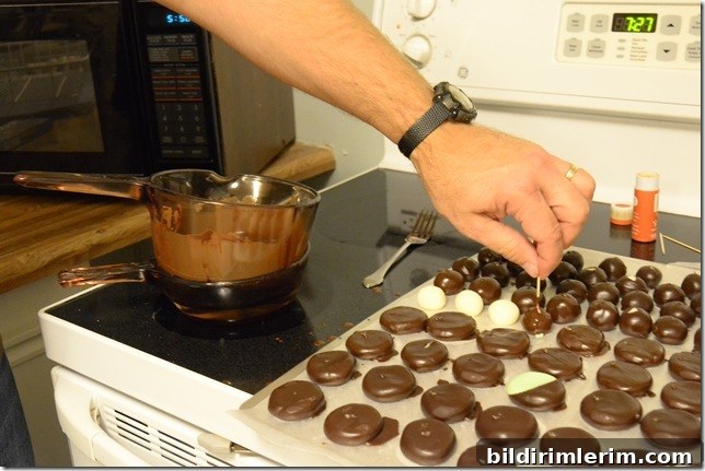 Meltaway chocolates being dipped in chocolate
