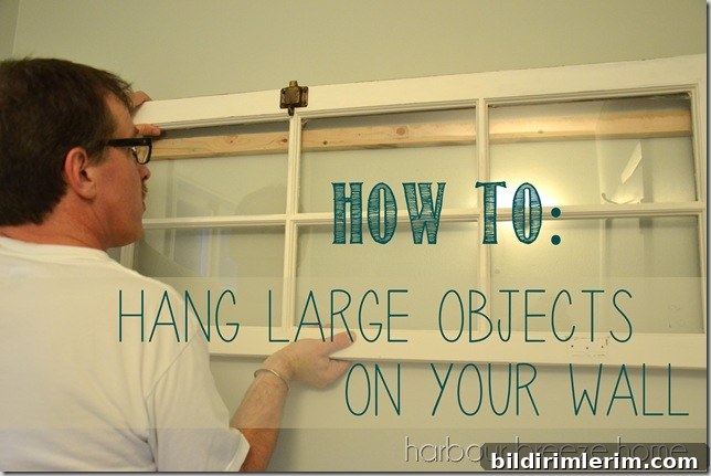 how to hang large objects with words a heavy old window being hung on a wall using a french cleat