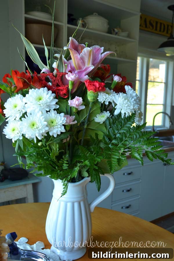 DIY Flower Arrangements Using Grocery Store Blooms 2 A bouquet of grocery store flowers in a big pitcher.