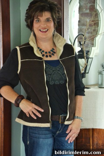 Outfit with shearling-style vest closeup