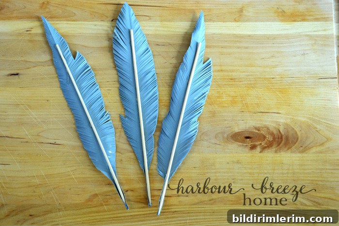 DIY Paper Feathers Tutorial: Handmade Feather Crafts 6 Bamboo Skewers glued to the back of paper feathers.