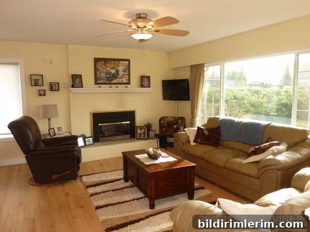 Open concept Living and Dining Room showing bright windows and fireplace