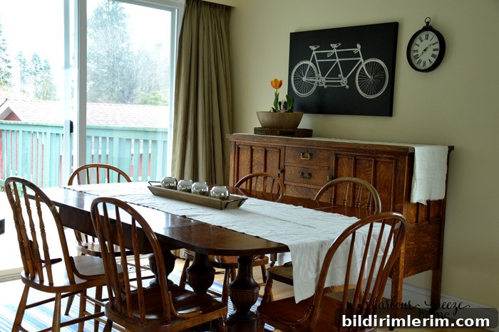 Dining space showing dining table and nearby cabinet