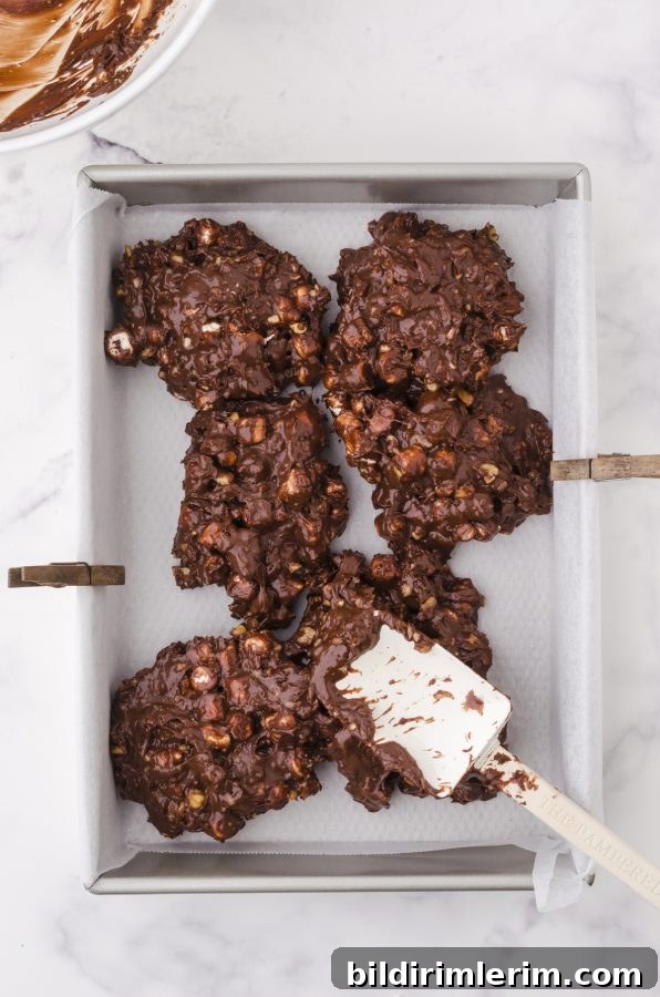 press fudge into a 9 x 13 inch pan with a spatula