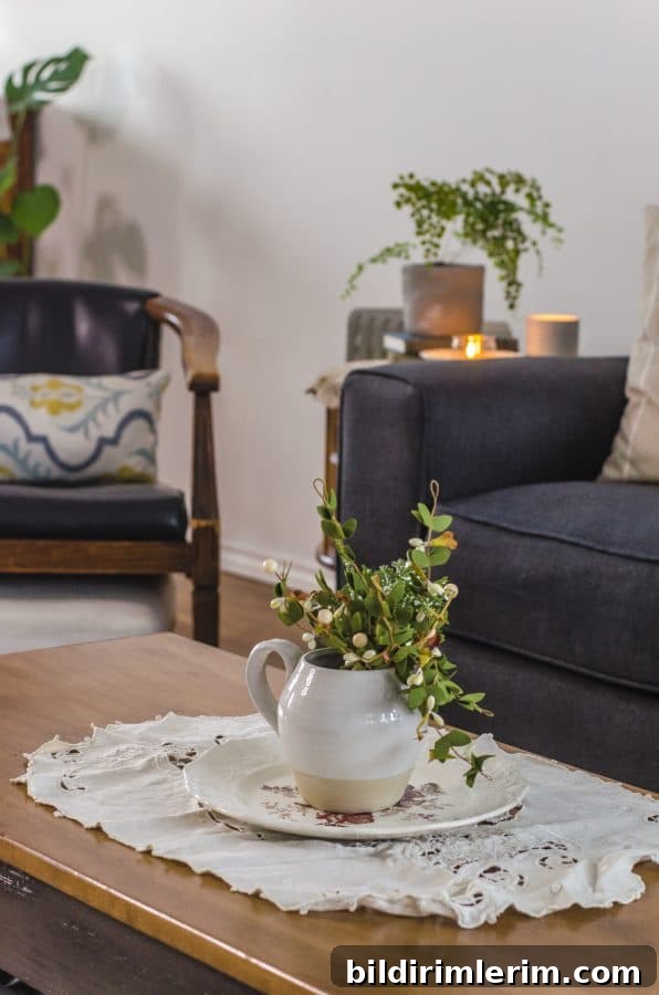 Cottagecore Winter Room Ideas for Warm, Inviting Spaces 2 cottagecore coffee table arrangement of a vintage stoneware plate and plant sitting on top of a vintage doily.