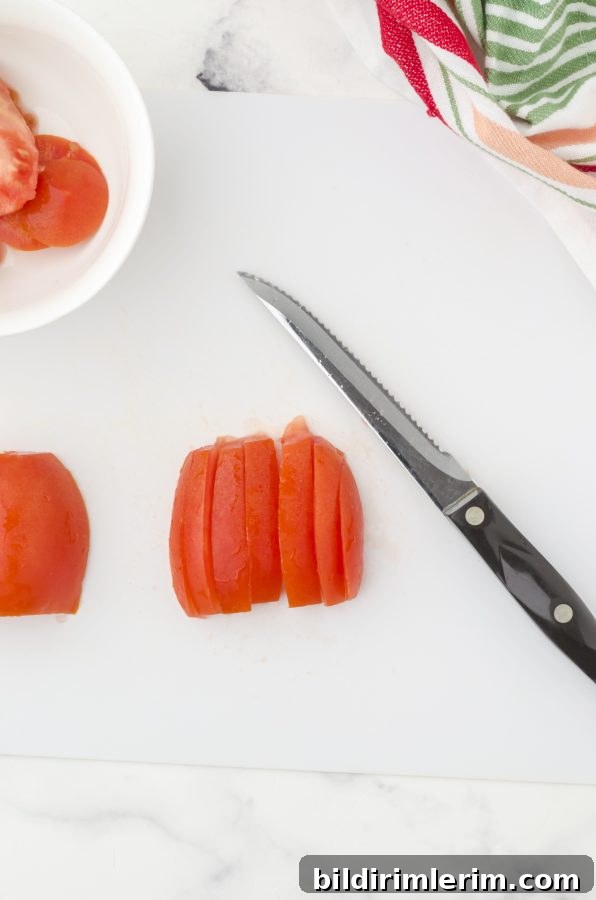 Slice tomatoes.