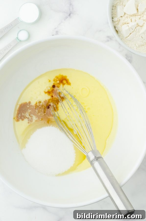 Egg, buttermilk, oil, sugar, and vanilla in a medium sized mixing bowl with a whisk.