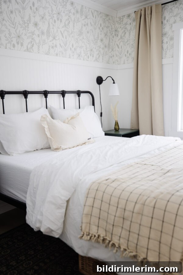 Weekend Reads: Spring Inspiration for Your Home 3 a bed made with beautiful white bed sheets and a throw blanket at the bottom of it.