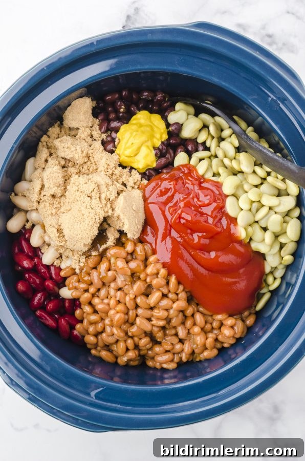 Crock pot baked beans ingredients in a crock pot.