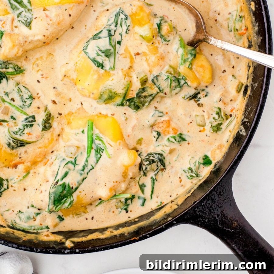Chicken florentine in a cast iron skillet ready to serve.