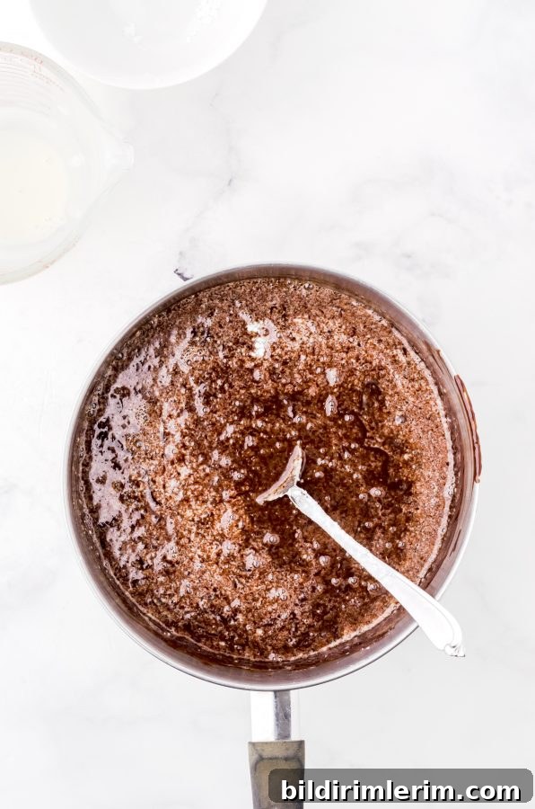 boiling hot fudge sauce in a saucepan