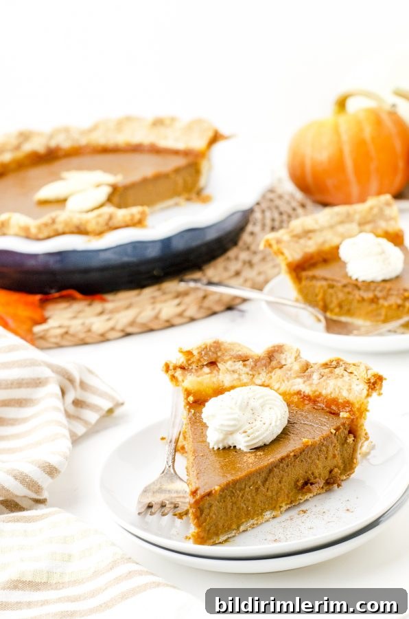Pumpkin pie served with whipped cream