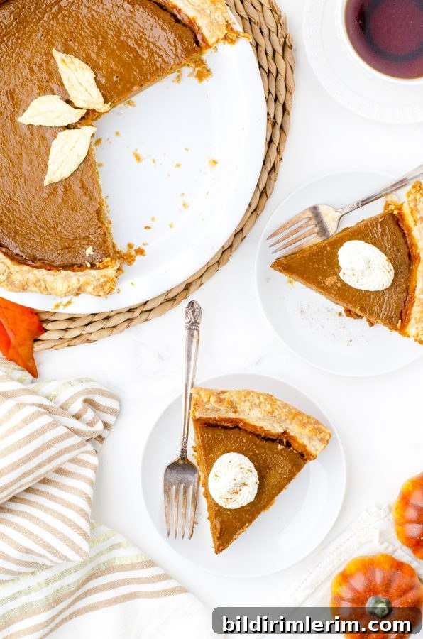 Slice of pumpkin pie at a holiday table