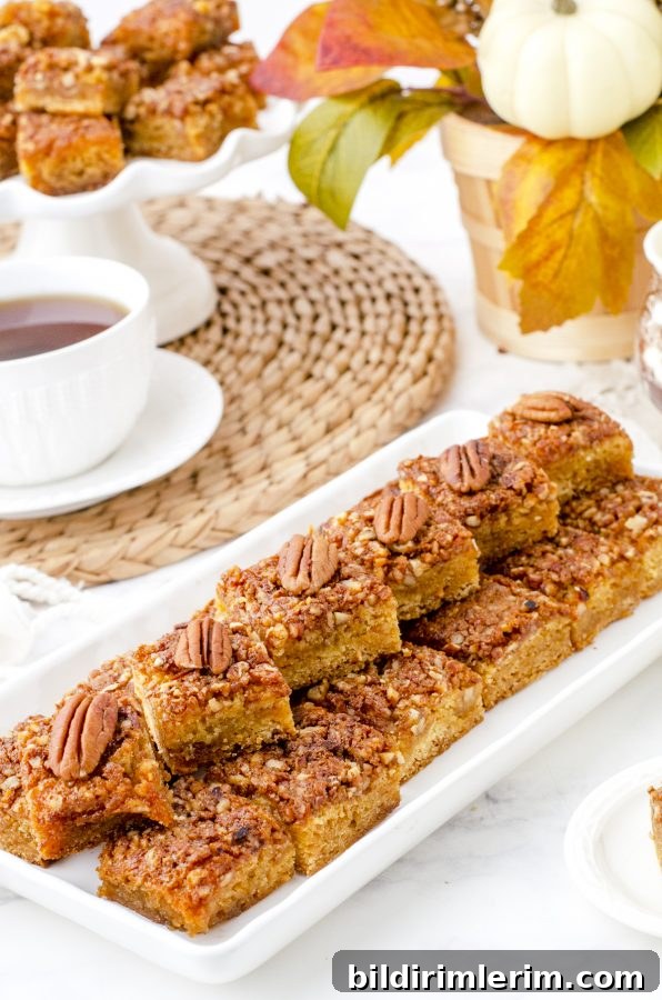 Platter of stacked pecan pie bars ready to be served to guests.