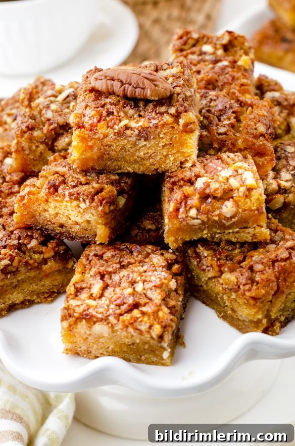 A platter of stacked pecan pie bar squares